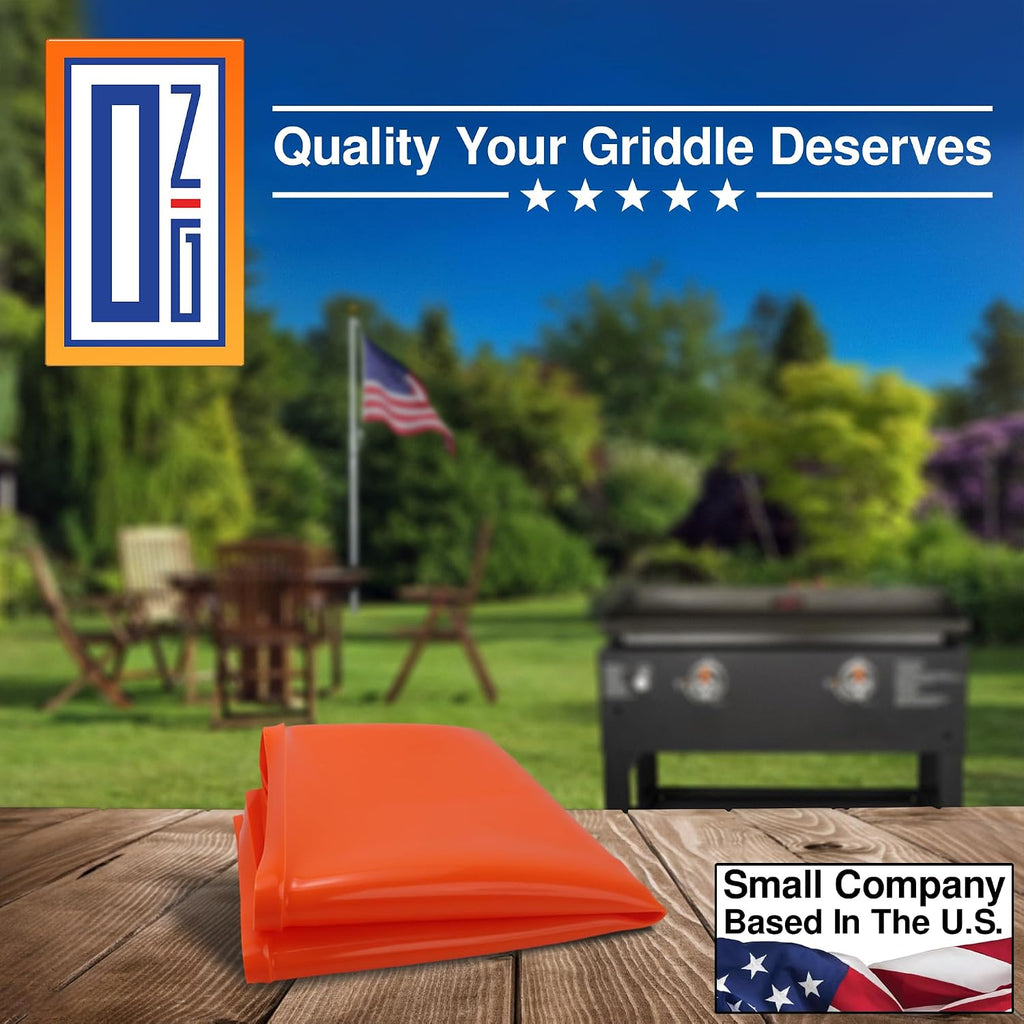 Folded orange OZG griddle mat on a backyard table, from a small company based in the U.S.